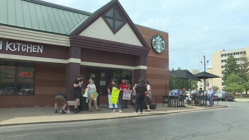 Starbucks employees at Peoria's Campustown location hold a strike in support of a fellow...