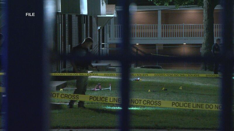 Peoria officers patrol the crime scene Tuesday night, after Christopher Tillman was killed.