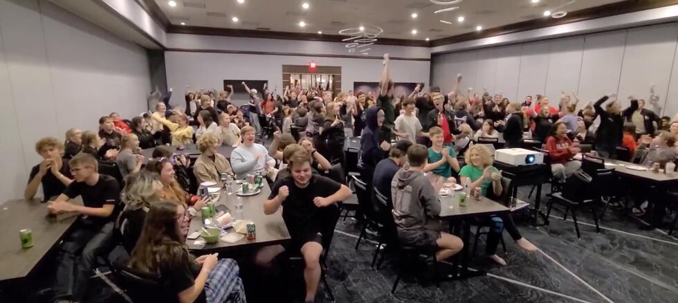 Morton Potters Marching Band members cheer as they learn they've advanced to the semifinals at...
