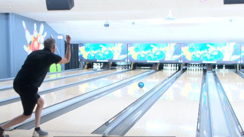 25News' evening anchor Tyler Lopez throws a strike on Sunday the annual Turkey Bowl.